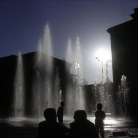 Playing with water - and the sun - in front of the Parliament Building, Кониц