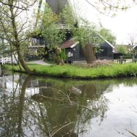 Windmill `De Ster` reflected in spring; Utrecht, Амерсфоорт