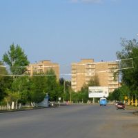 Abai avenue with abandoned houses at the background, Аркалык
