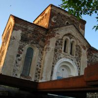 Rusty cross laying near All Saints Ortodox Church in Biahomĺ, Бегомль