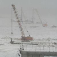 Construction of the bridge. The construction site on the ice of the Angara River. Строительство моста, стройплощадка на льду Ангары. 2009г., Абакан