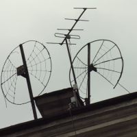 Funny TV antennas at roof of house on Petrovskaya embankment, Выборг