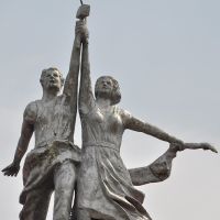 Sculpture "Worker and Kolkhoz Woman" at roof of house of Culture in Bikin town, Бикин