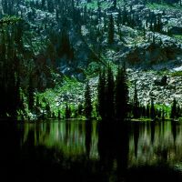 Dark waters of Center Creek Lake. Frank Church Wilderness, Маунтейн-Хоум