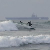 Surfing in Imperial Beach, CA with Departing U.S. Aircraft Carrier, Империал-Бич