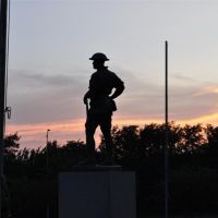 World War I bronze soldier against sunset, Olathe Memorial Cemetary, Olathe, KS, Овербрук