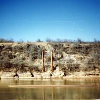 Remains of suspension bridge on the Red River, known as burned out bridge. Photo by R. Rogers., Жеронимо