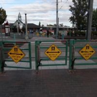 Bilingual danger signs at Beaverton Transit Center, Бивертон