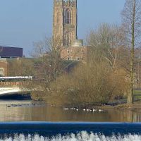 Derby: Cathedral from riverside path, Дерби
