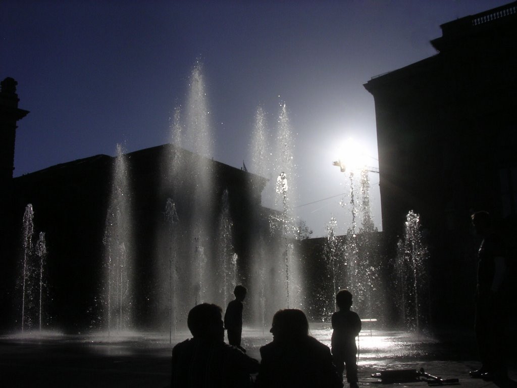 Playing with water - and the sun - in front of the Parliament Building, Кониц