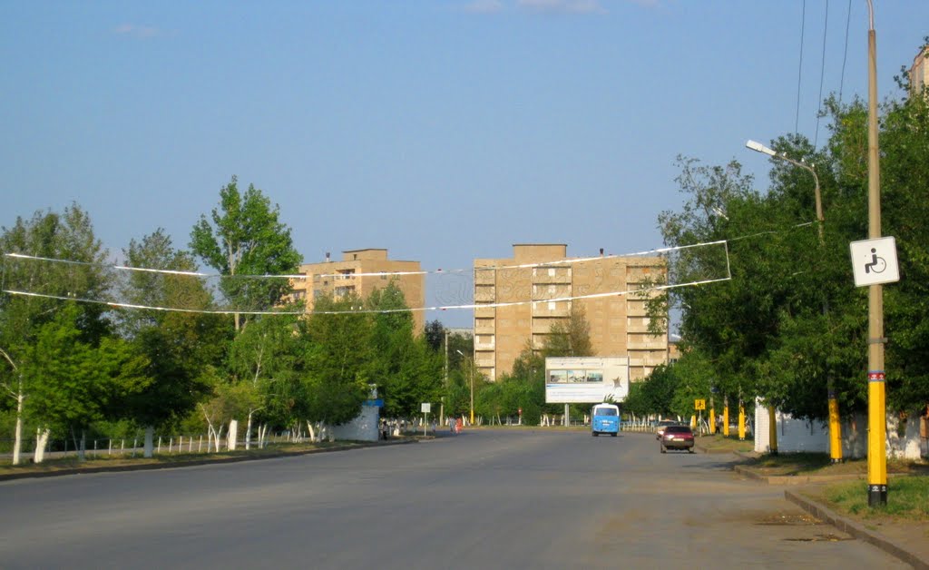 Abai avenue with abandoned houses at the background, Аркалык