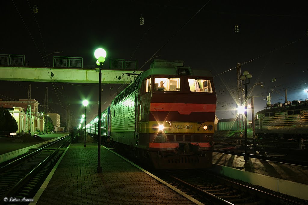 Electric locomotive ChS4T-697 with train Rostov - Adler on train station Bataysk, Батайск
