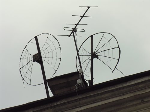Funny TV antennas at roof of house on Petrovskaya embankment, Выборг