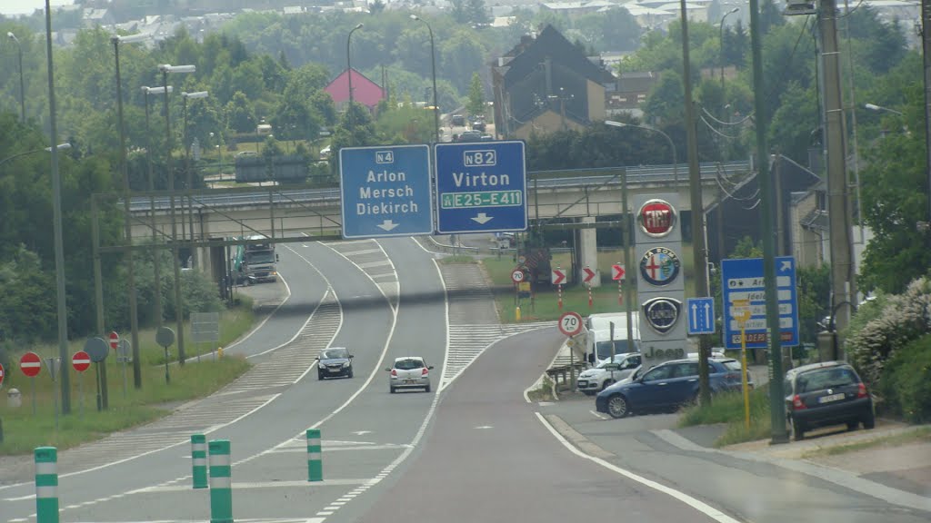 De Rijksweg E25-E411 en de Bewegwijzeringen, Арлон