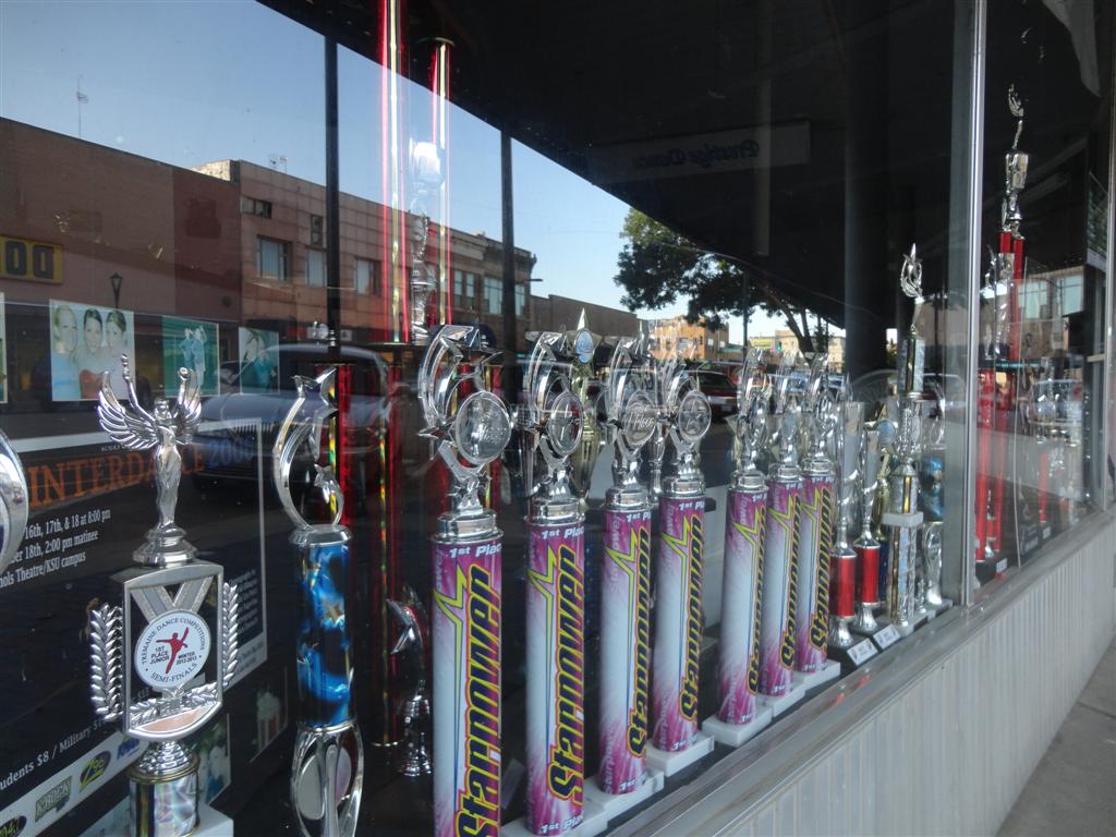 trophies in the window, downtown Salina, KS, Салина