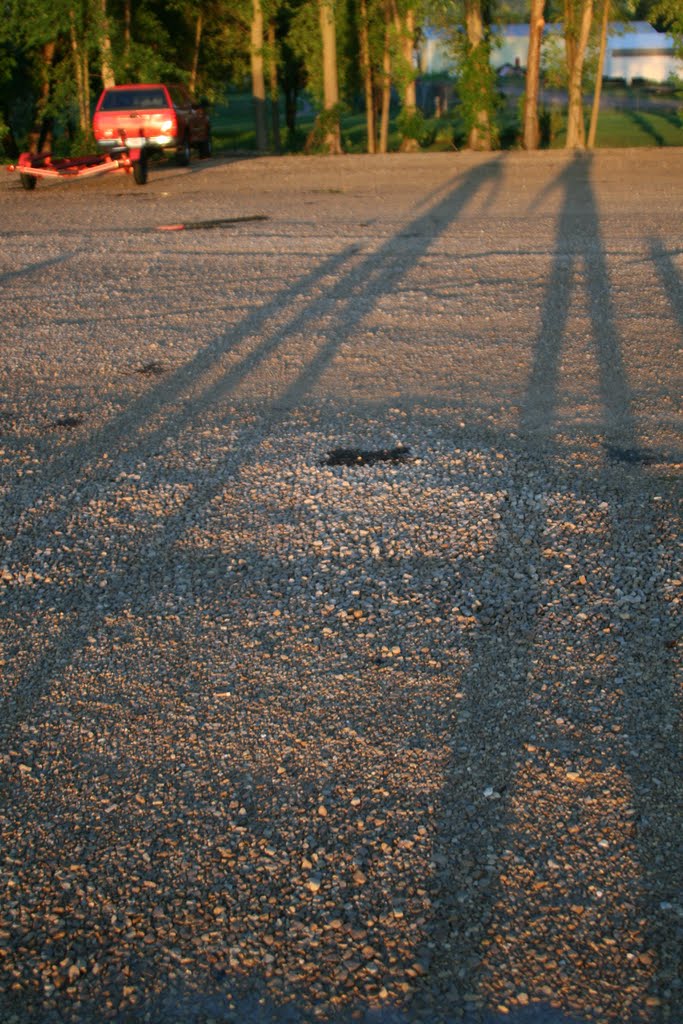 Sunset casts long shadows of my son and I at Stoddard boat landing, Браунсвилл