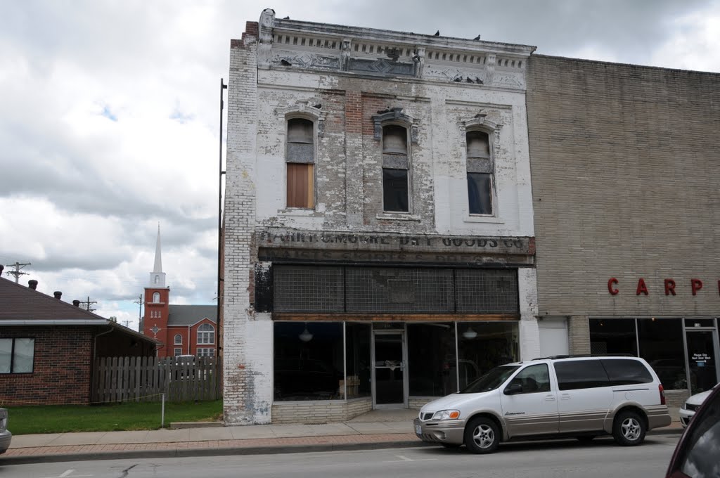 Old building in Nevada, MO still carrying the name of the store Harry Moore Dry Goods Co that closed in 1885, Невада