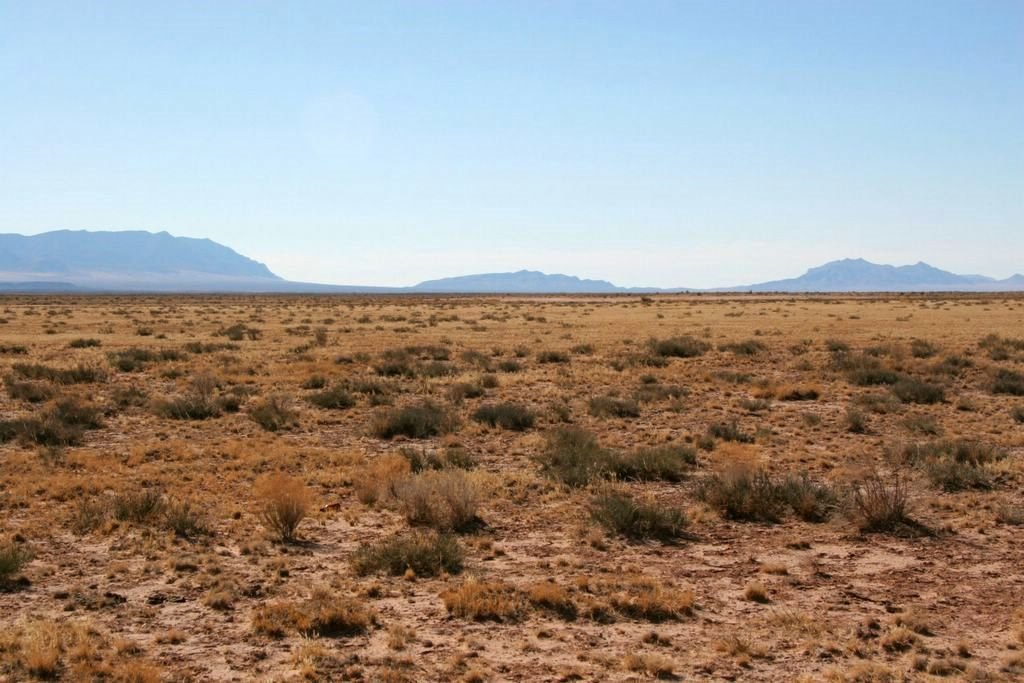 Somewhere out across this New Mexican desert is "Trinity Site", where the first atomic bomb was detonated, Берналилло