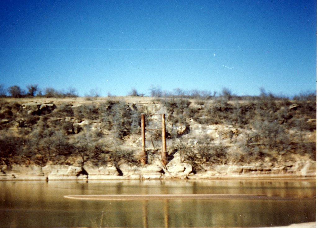 Remains of suspension bridge on the Red River, known as burned out bridge. Photo by R. Rogers., Жеронимо