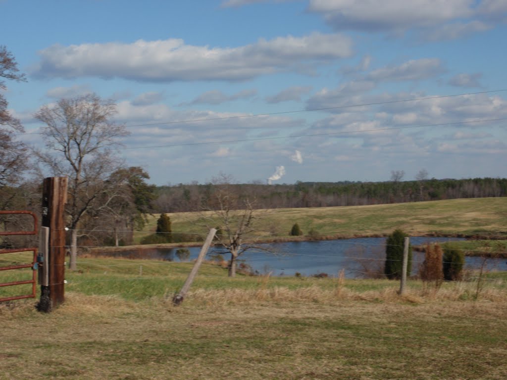 rolling hills of Lee County descending into the Deep and Cape Fear River valley, with a farm pond in the foreground and steam from the Shearon Harris Nuclear Power Plant cooling tower in the distance, 12-5-10, Балфоур