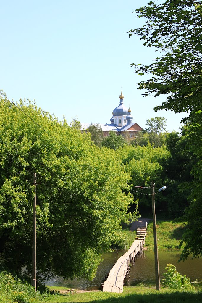 Korets. The view the wooden bridge and the Ressurection church., Корец